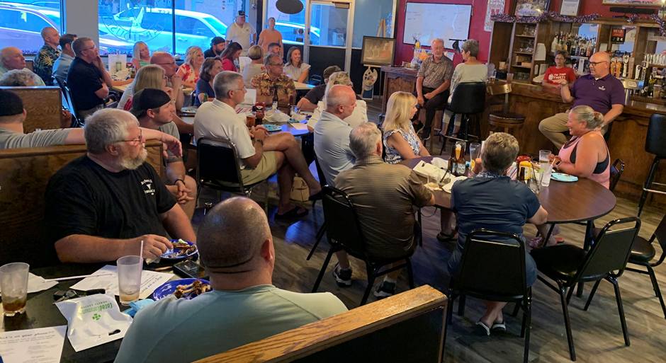 men watching speaker