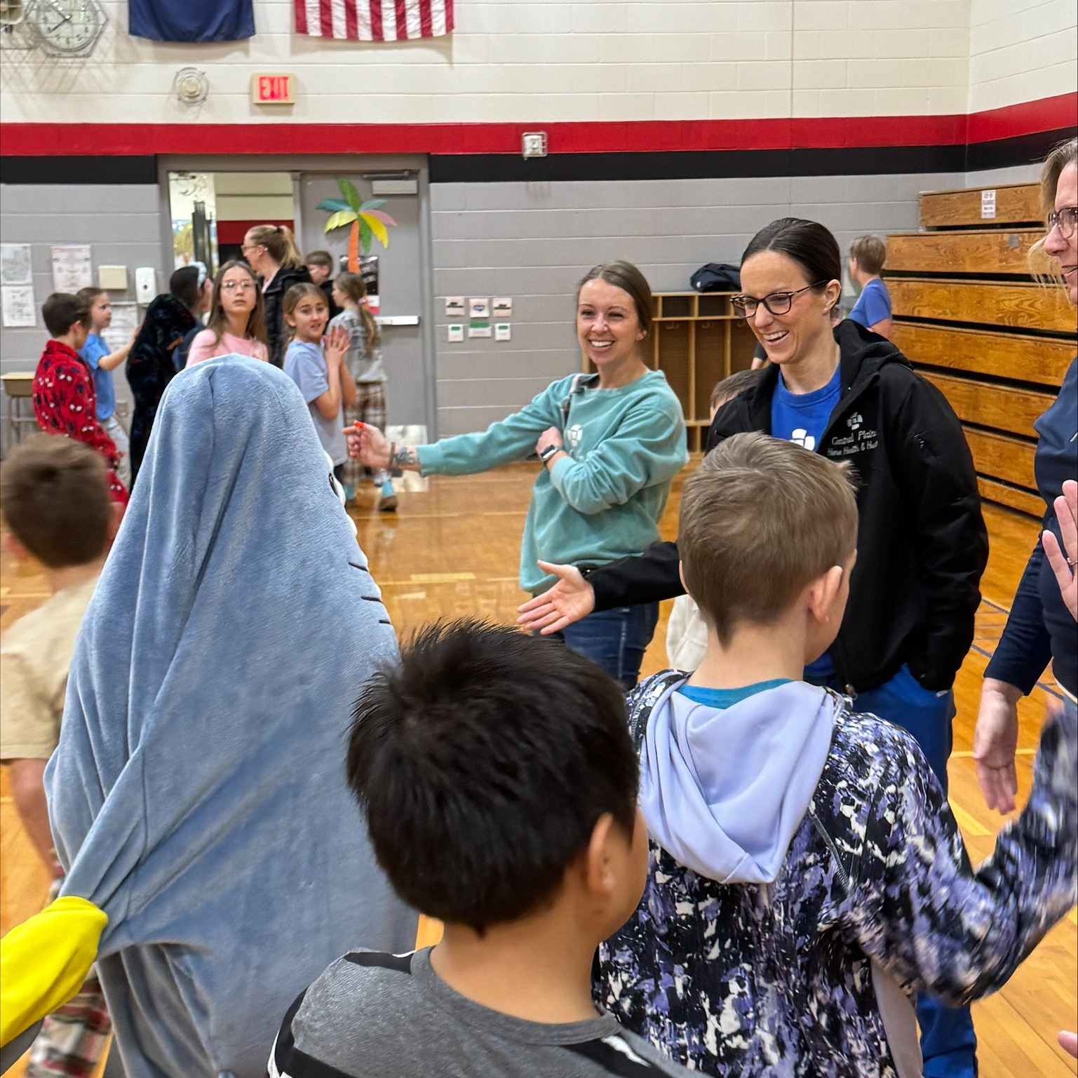 kids high fiving staff